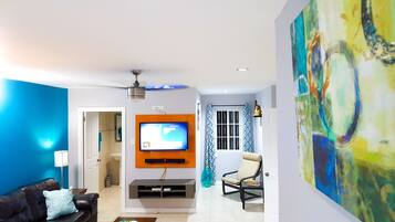 Superior Apartment, 2 Bedrooms, Ground Floor | Living room | 50-inch flat-screen TV with cable channels, TV, DVD player