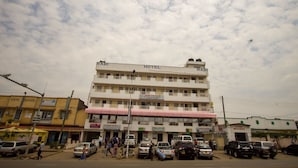 A multi-story building with a sign that reads "RABI HOTEL" on the top. - Rabi Hotel (Nairobi)