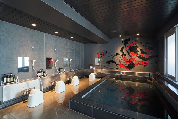 Separate tub and shower, slippers, towels, soap