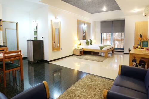 Premium Double Room | Living area | Flat-screen TV