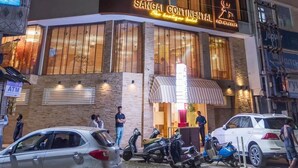 A multi-story hotel with balconies, an ATM, and parked vehicles. - Sangai Continental The Boutique Hotel (Imphal)