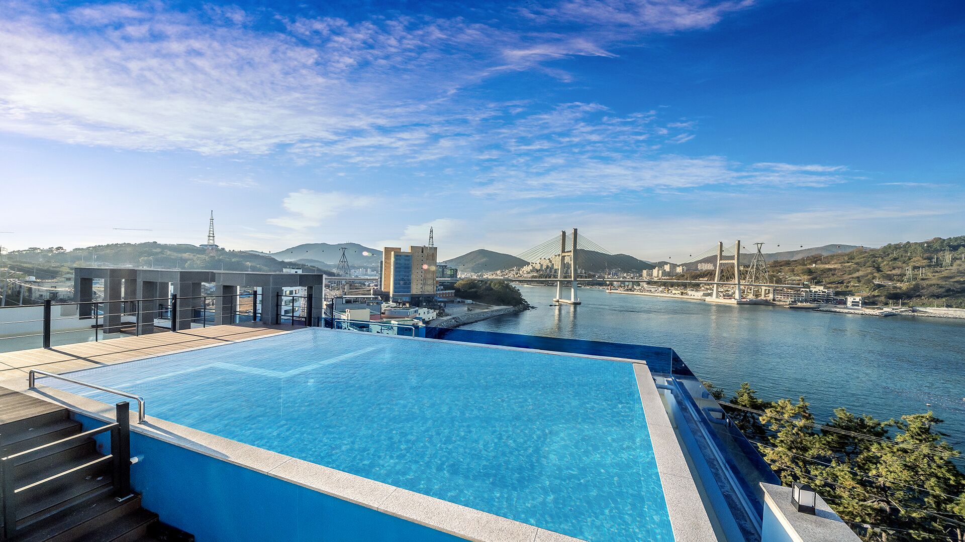 Seasonal outdoor pool, open 3:00 PM to 10:00 PM, pool umbrellas