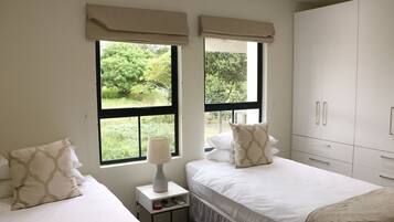 Premium bedding, desk, laptop workspace, soundproofing