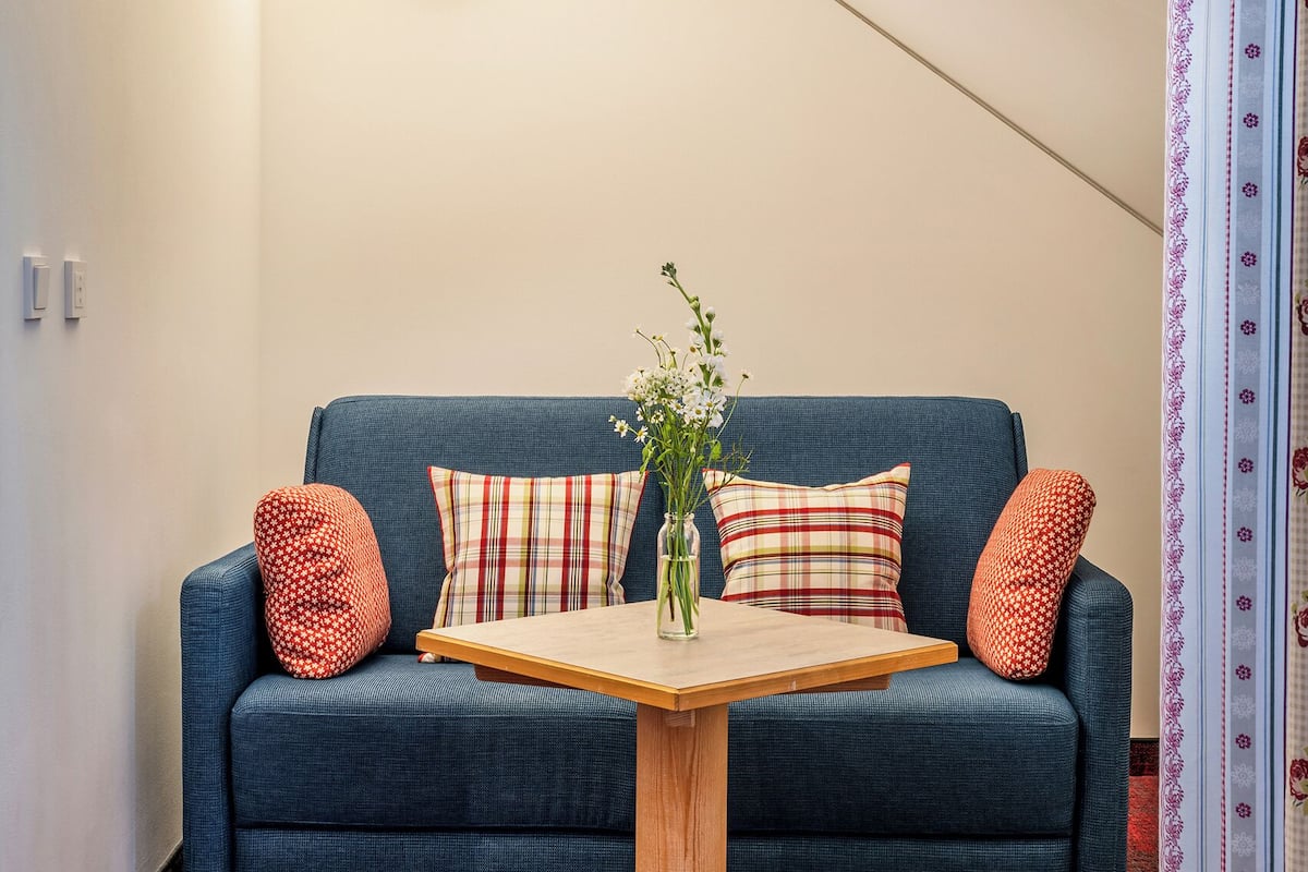 double room, balcony | living area | flat-screen tv, ping pong, books