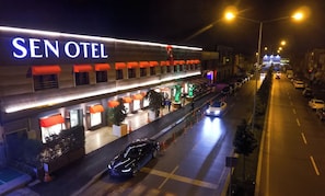 A hotel named SEN OTEL with a modern facade, outdoor seating area, and a well-lit entrance. - Sakarya Sen Hotel (Serdivan)