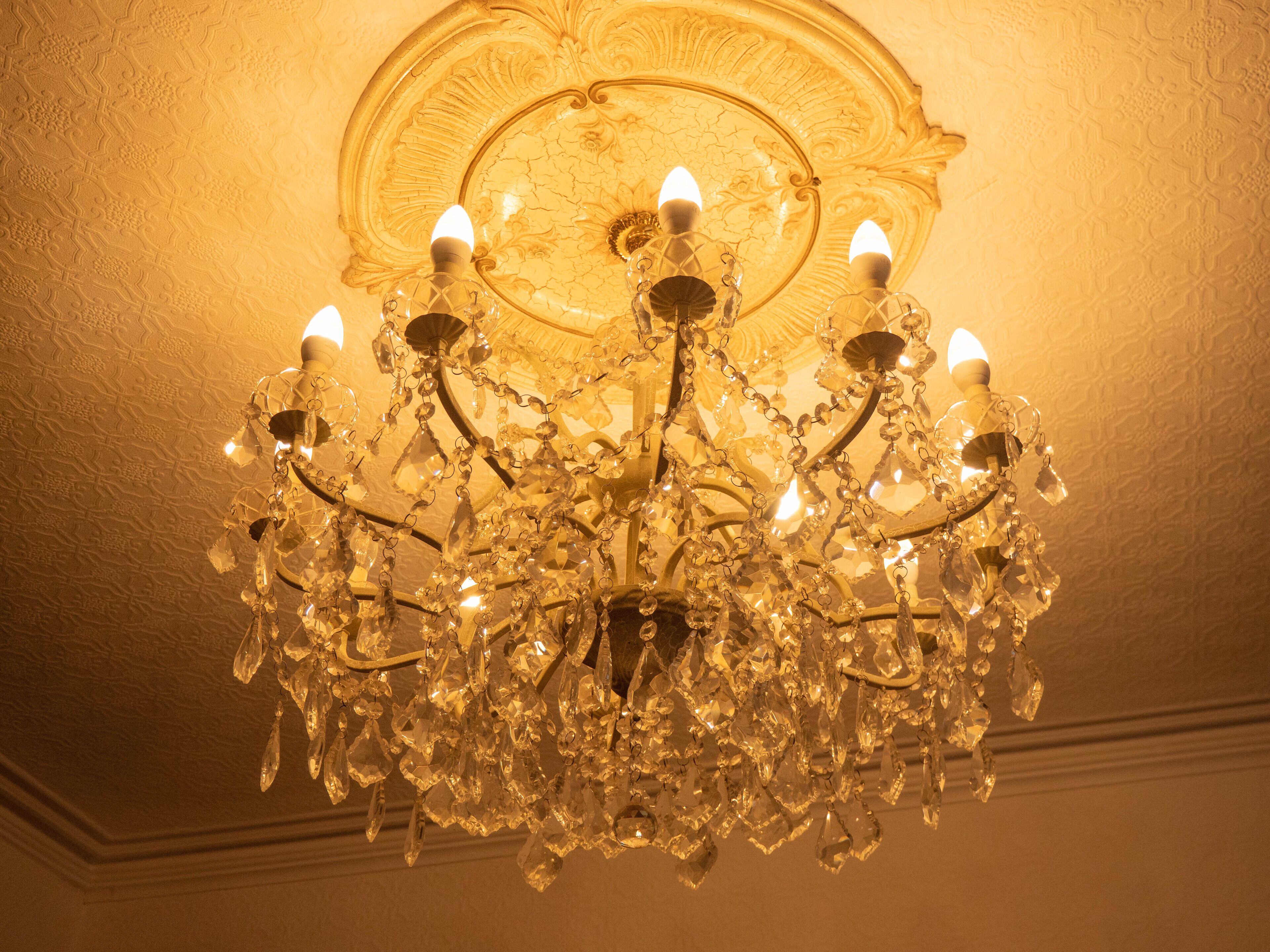 A chandelier with multiple crystal elements and light fixtures.