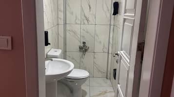 Shower, free toiletries, slippers, towels