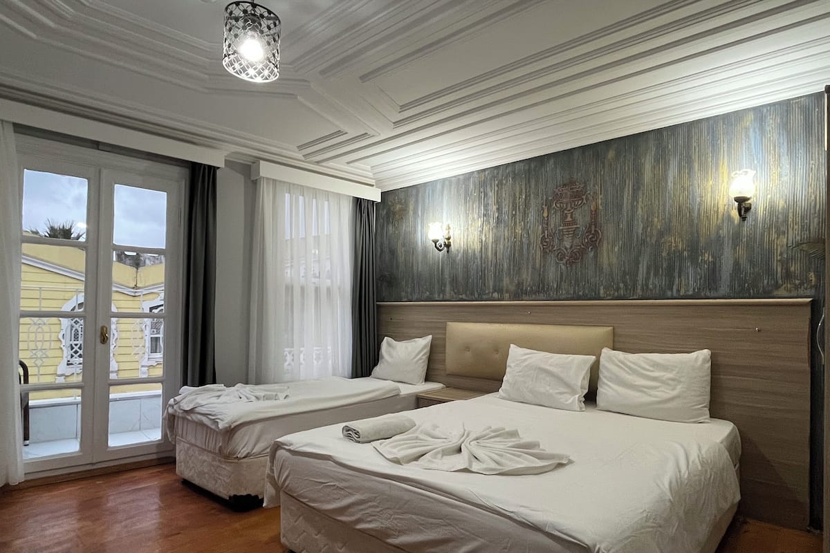 Triple Room, Balcony, City View | 1 bedroom, premium bedding, in-room safe, individually decorated