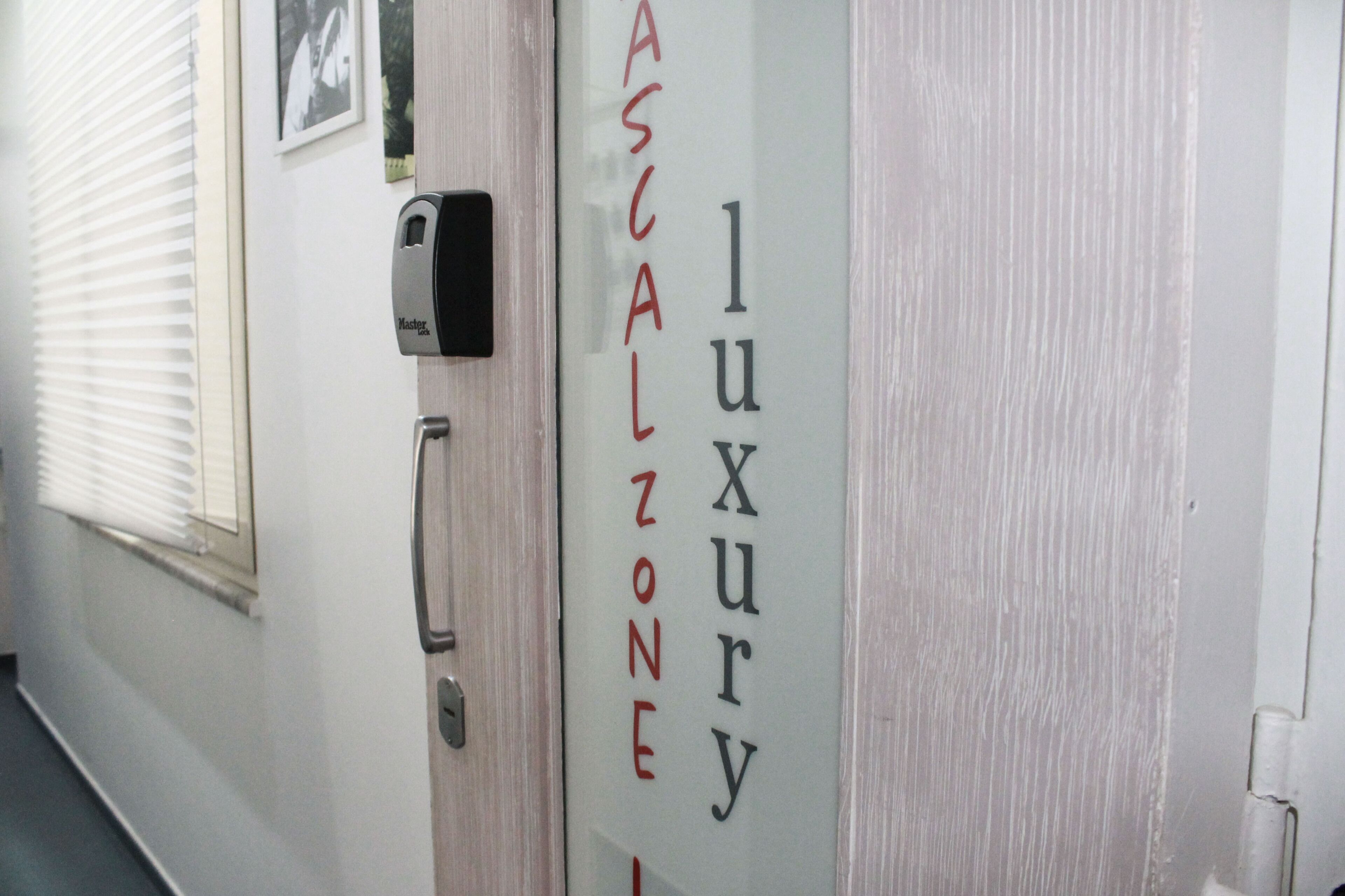A hallway with a door labeled "luxe" and "luxury zone."