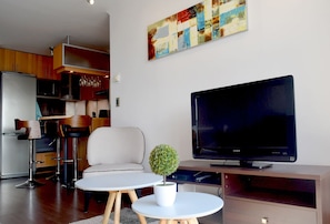 Standard Apartment | Living area | LCD TV - Alquílame - Apartamento Escuela Militar (Santiago)