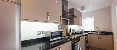 Deluxe Apartment, 1 Bedroom | Private kitchen | Full-size fridge, microwave, oven, stovetop