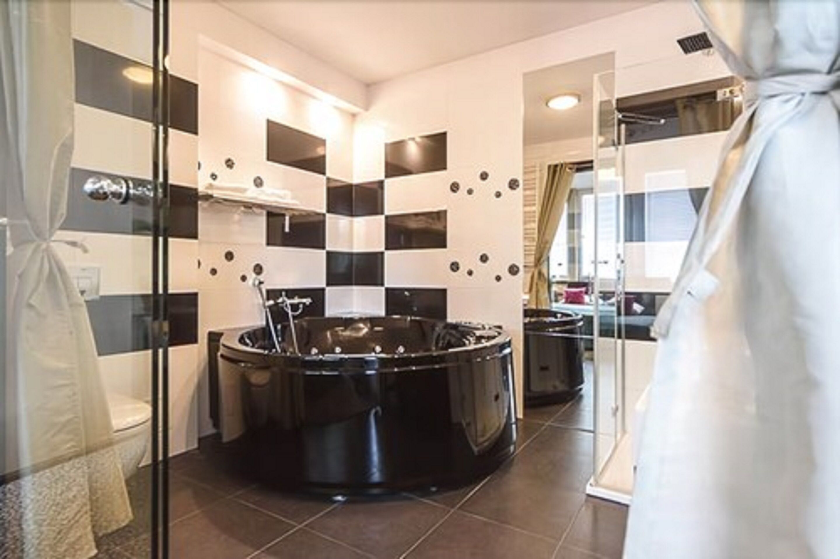 luxury apartment | in-room safe, desk, blackout curtains, iron/ironing board