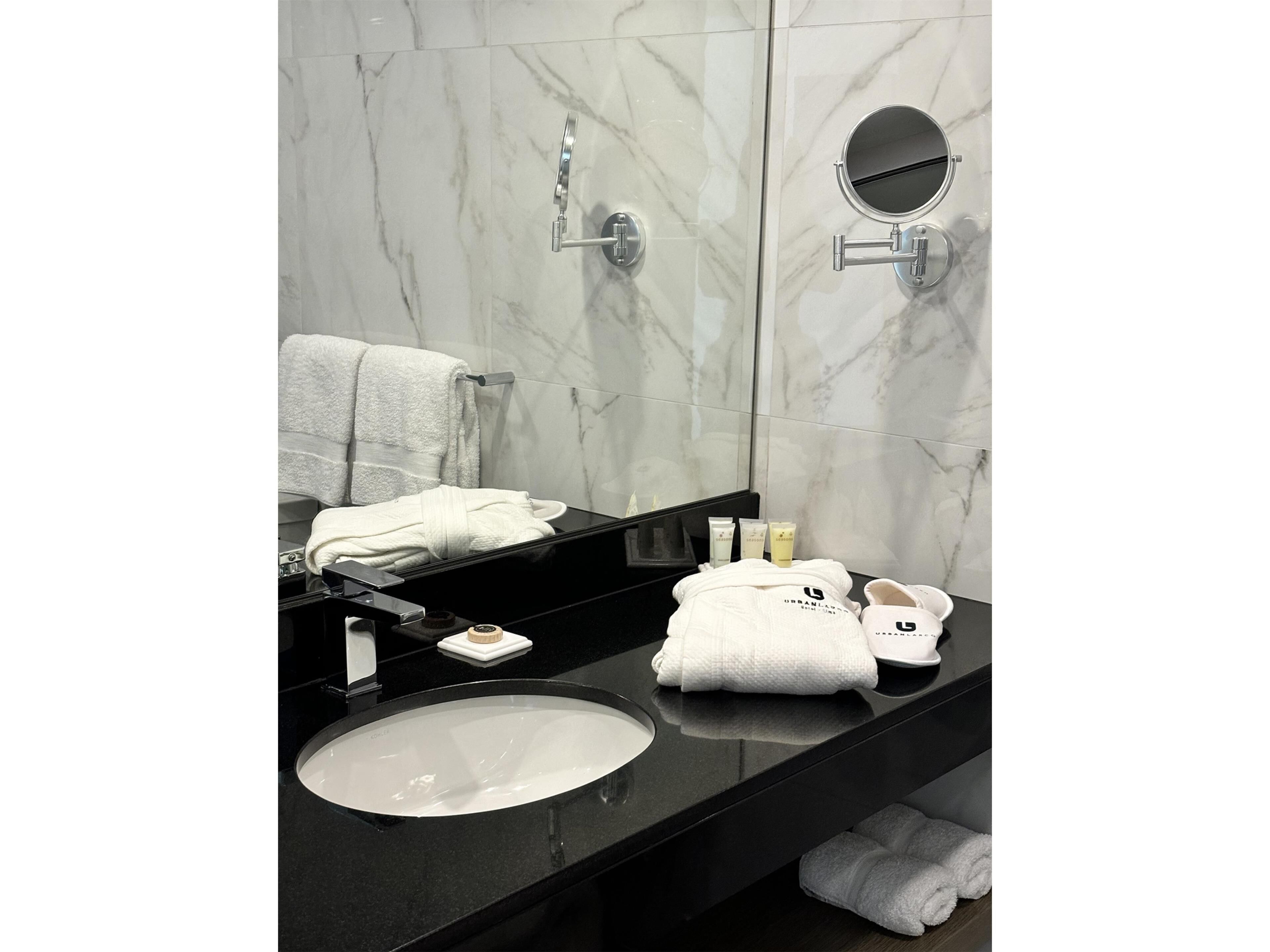 shower, rainfall showerhead, hair dryer, towels