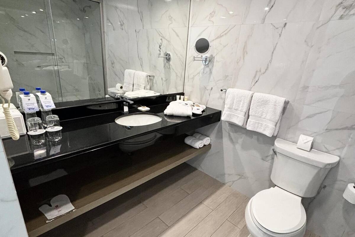 shower, rainfall showerhead, hair dryer, towels