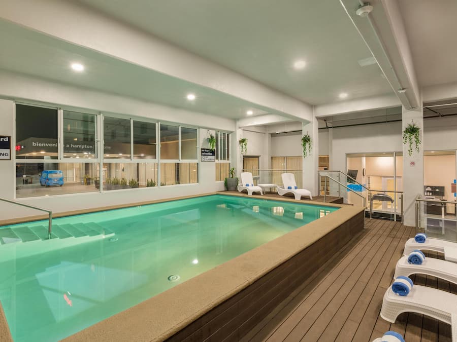 Indoor pool, open 10:00 AM to 9:00 PM, pool loungers