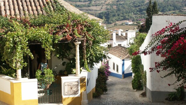 A rural guest house with a cobblestone path leading to it, surrounded by greenery and traditional architecture. - Converted stables - double studio 8km Obidos with elevated deck & full kitchen (Obidos)