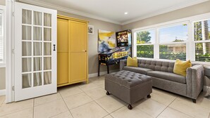 Living area - NEW PINBALL & LOUNGERS! Cute Designer Home, Heated Pool, Close Beach, FREE Bikes (Naples)