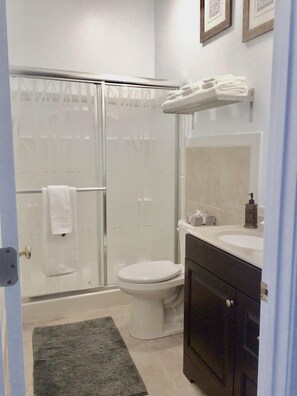 Shower, hair dryer, towels, soap