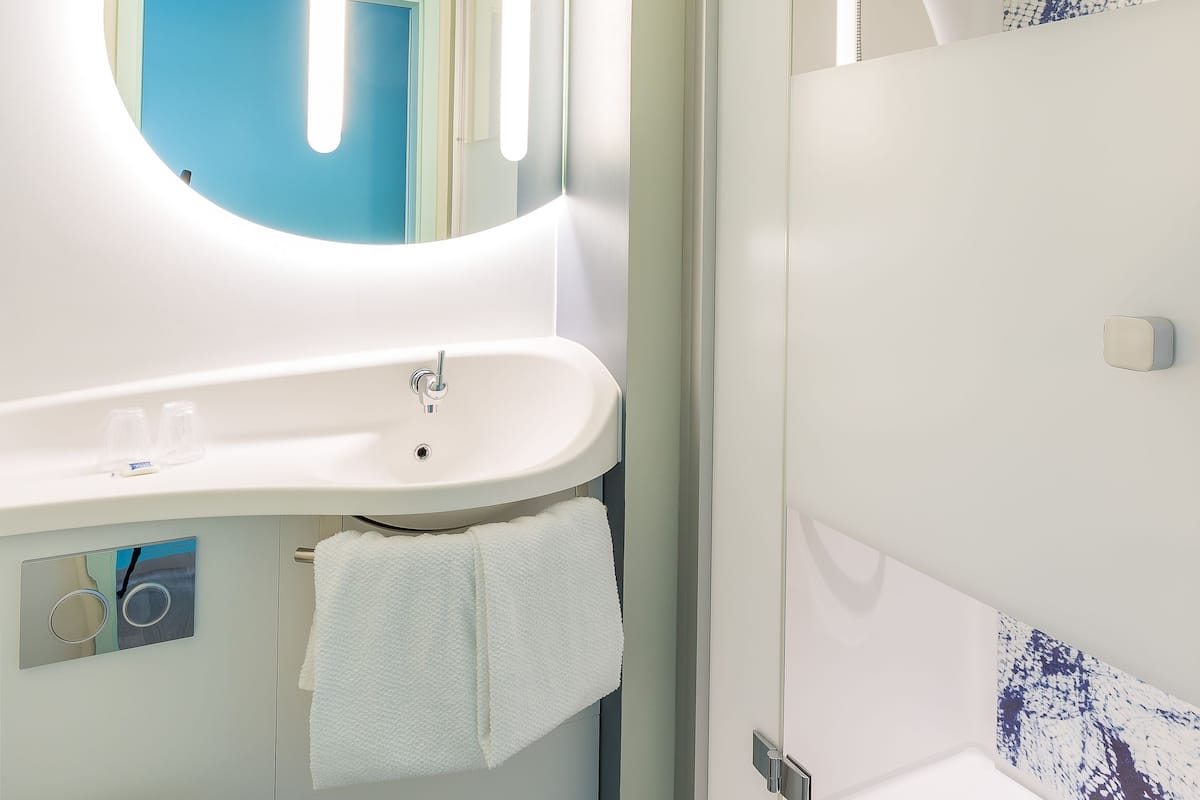 room, multiple beds | bathroom | shower, eco-friendly toiletries, hair dryer, towels