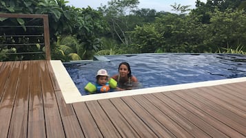 Surround yourself with lush greenery and enjoy a refreshing swim in the pool.