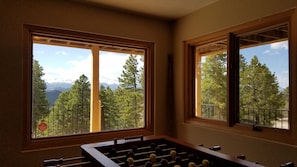 Enjoy a game of foosball with a mountain view from the comfort of this room.