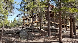 Mountain home with two story wrap-around deck.