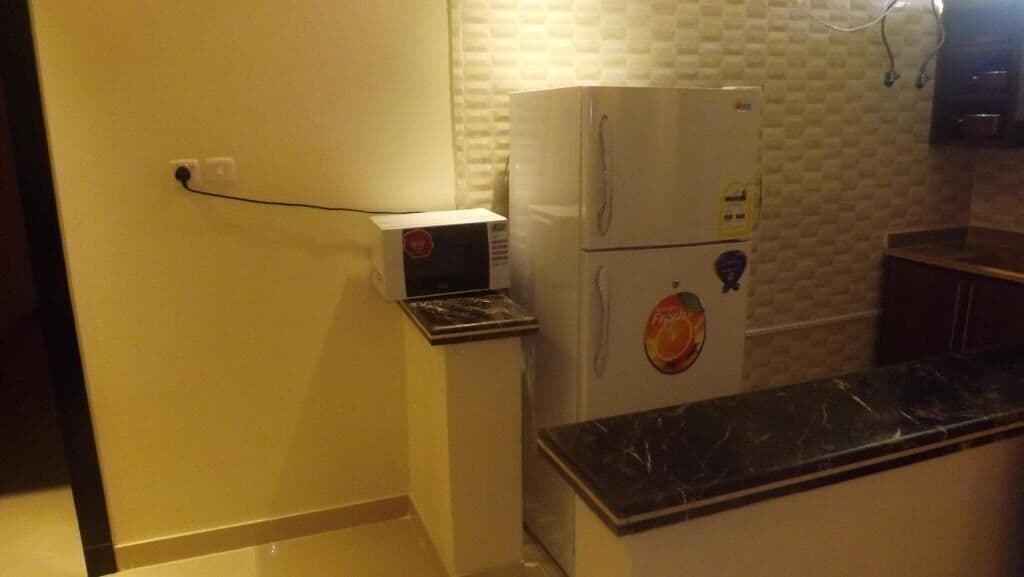 Apartment, 1 Bedroom, Kitchen | Dapur peribadi | Peti sejuk, cerek elektrik, bekalan pembersihan 