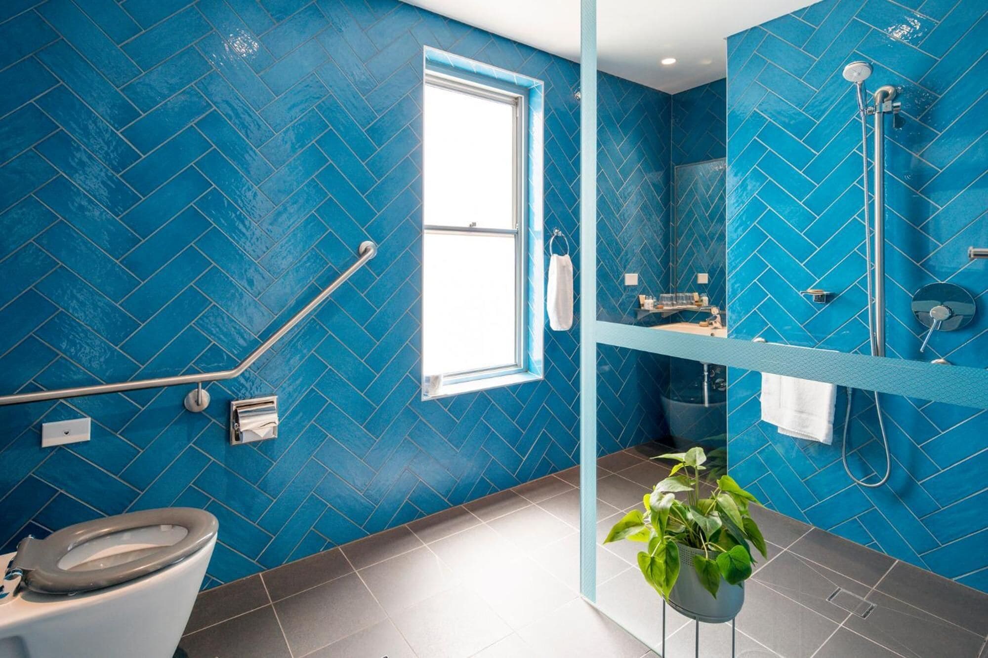 designer toiletries, hair dryer, towels