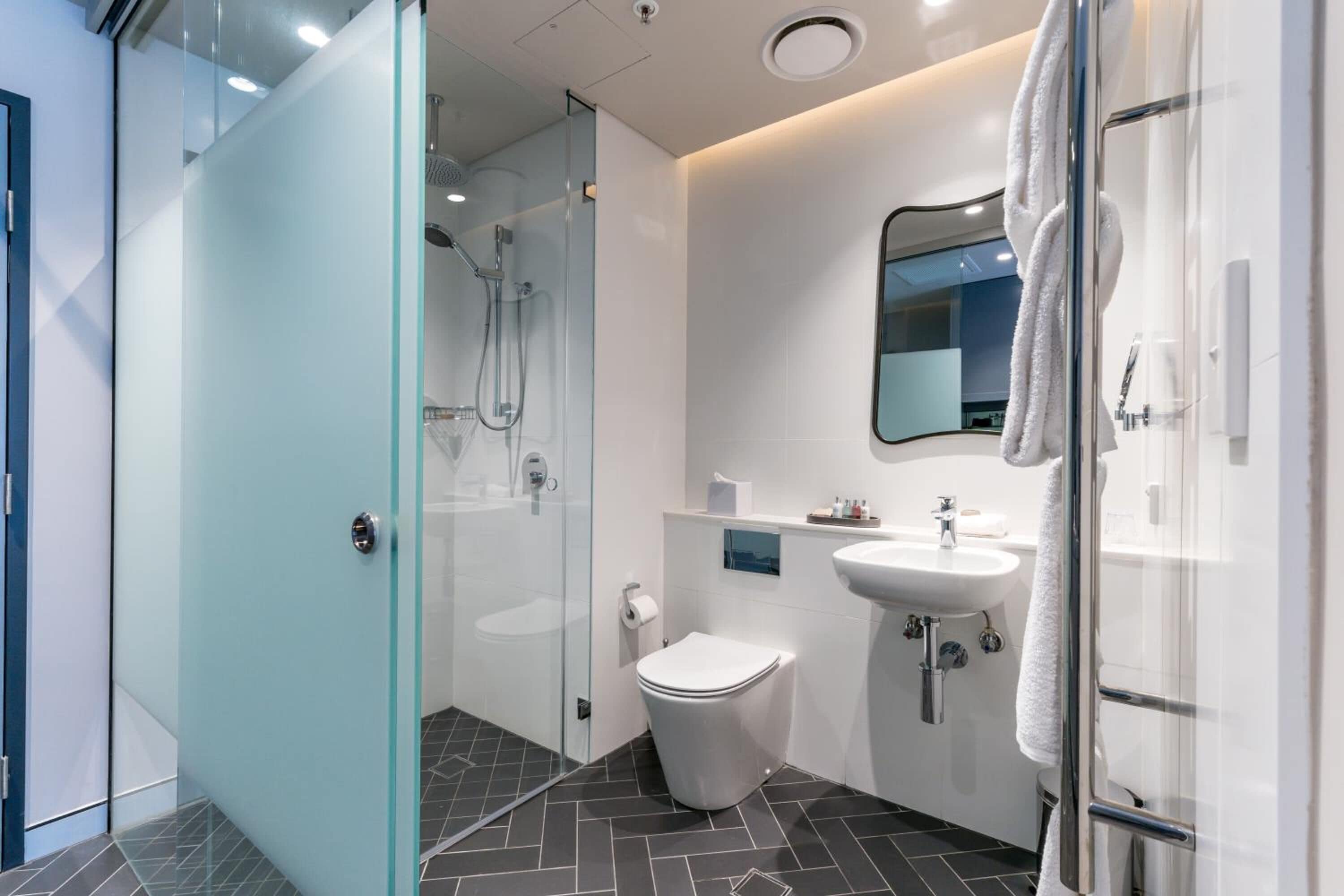 designer toiletries, hair dryer, towels