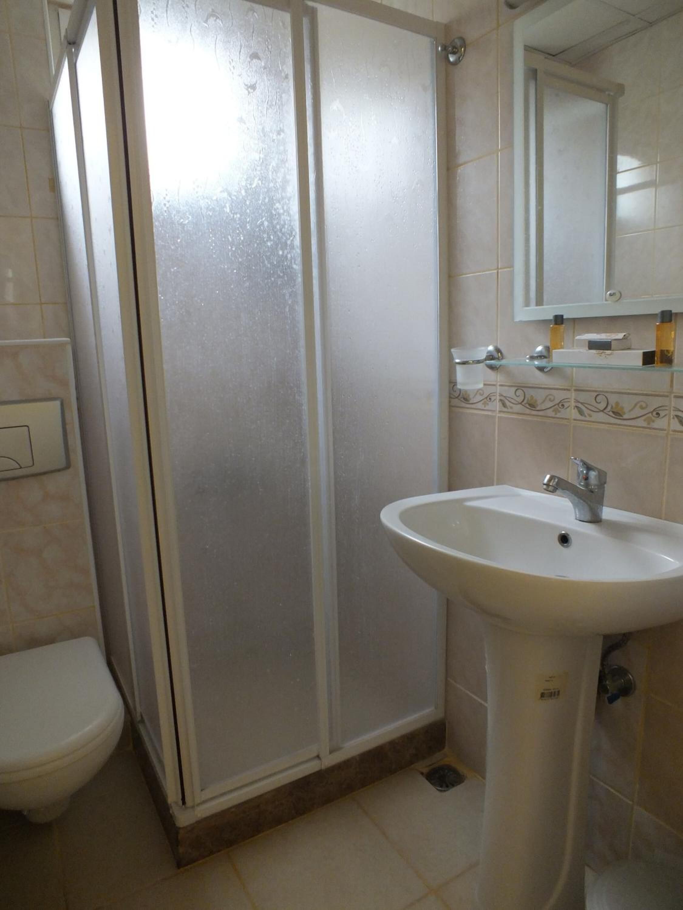standard double or twin room | bathroom | shower, hair dryer, slippers, towels