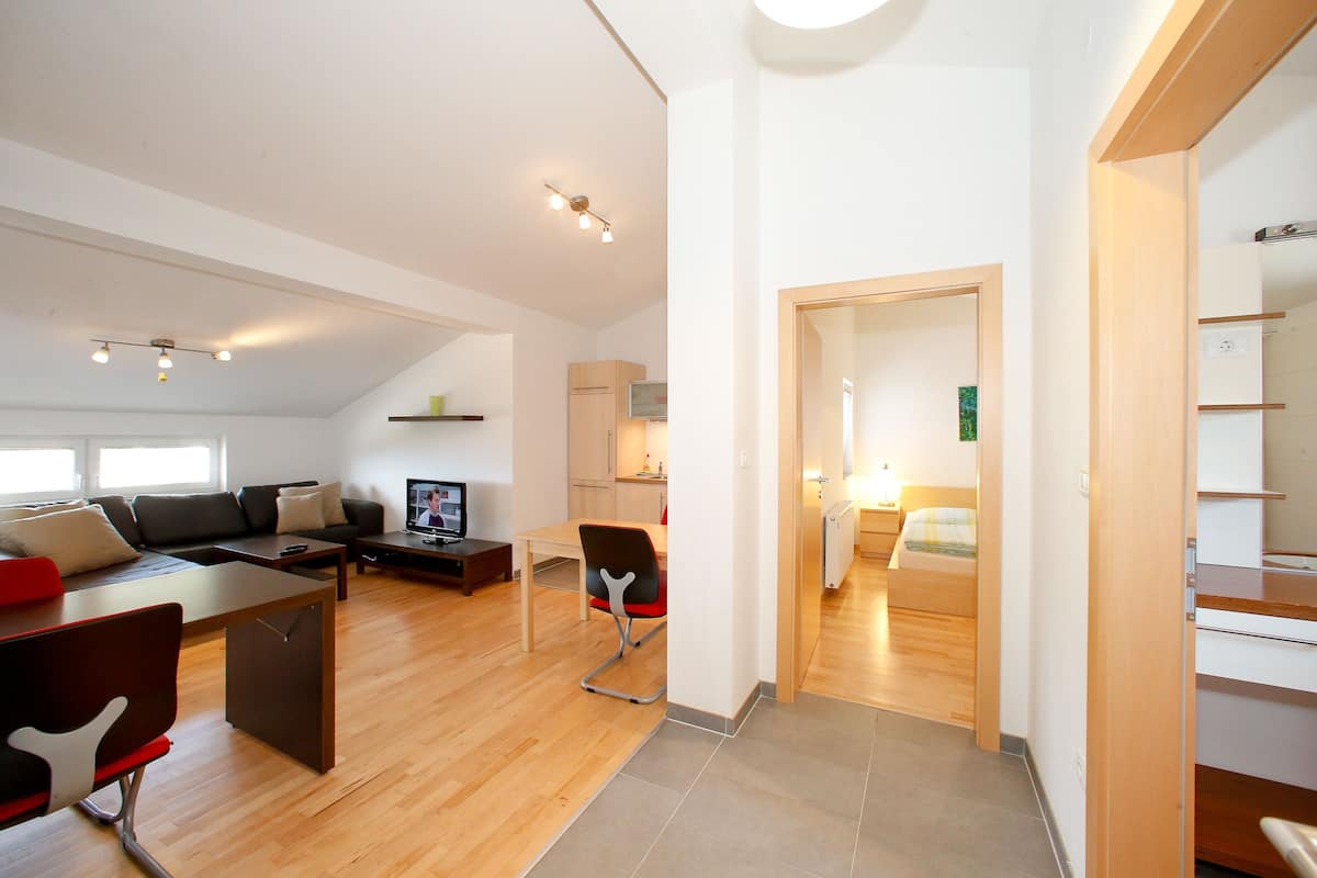 comfort apartment, 1 bedroom, sea view | living area | flat-screen tv, pay films