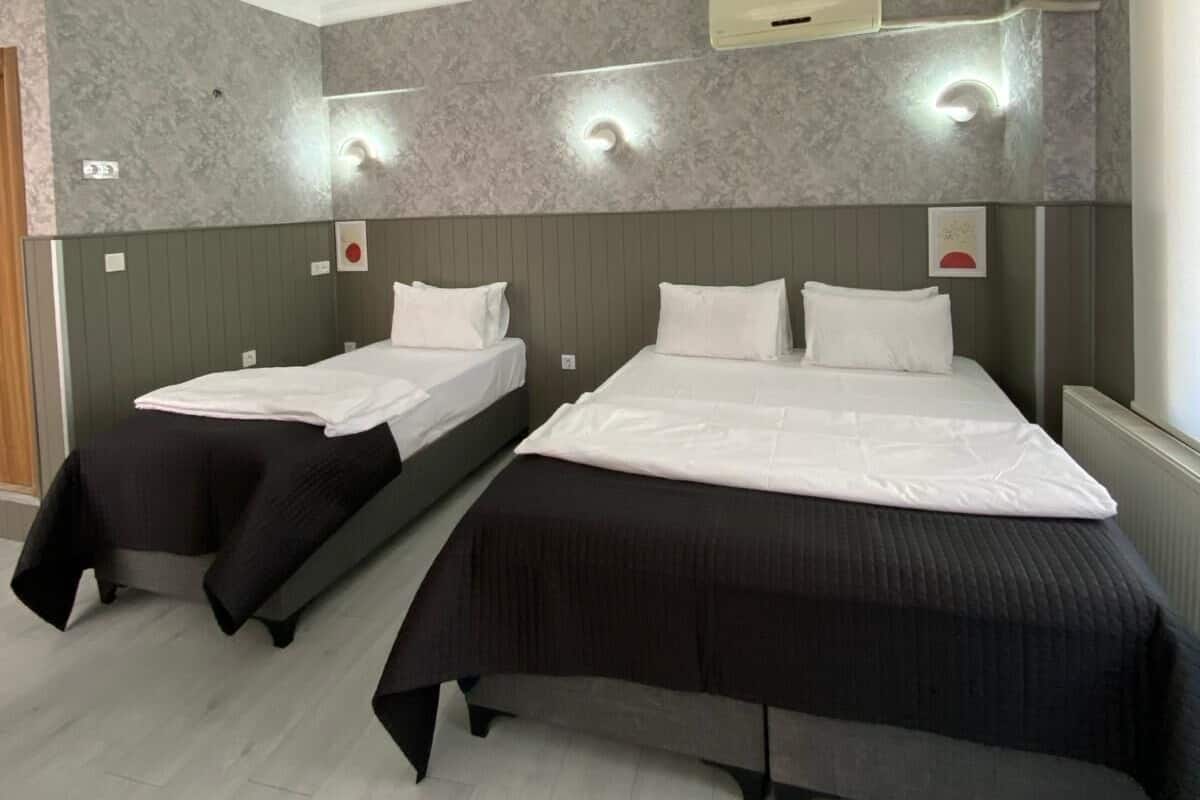 Triple Room | 1 bedroom, minibar, in-room safe, individually decorated