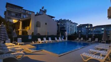 Seasonal outdoor pool, open 10:00 AM to 6:30 PM, pool umbrellas