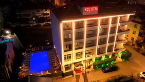 A hotel with a pool, multiple balconies, and a sign reading "KOC OTEL". - Koc Hotel (Karasu)