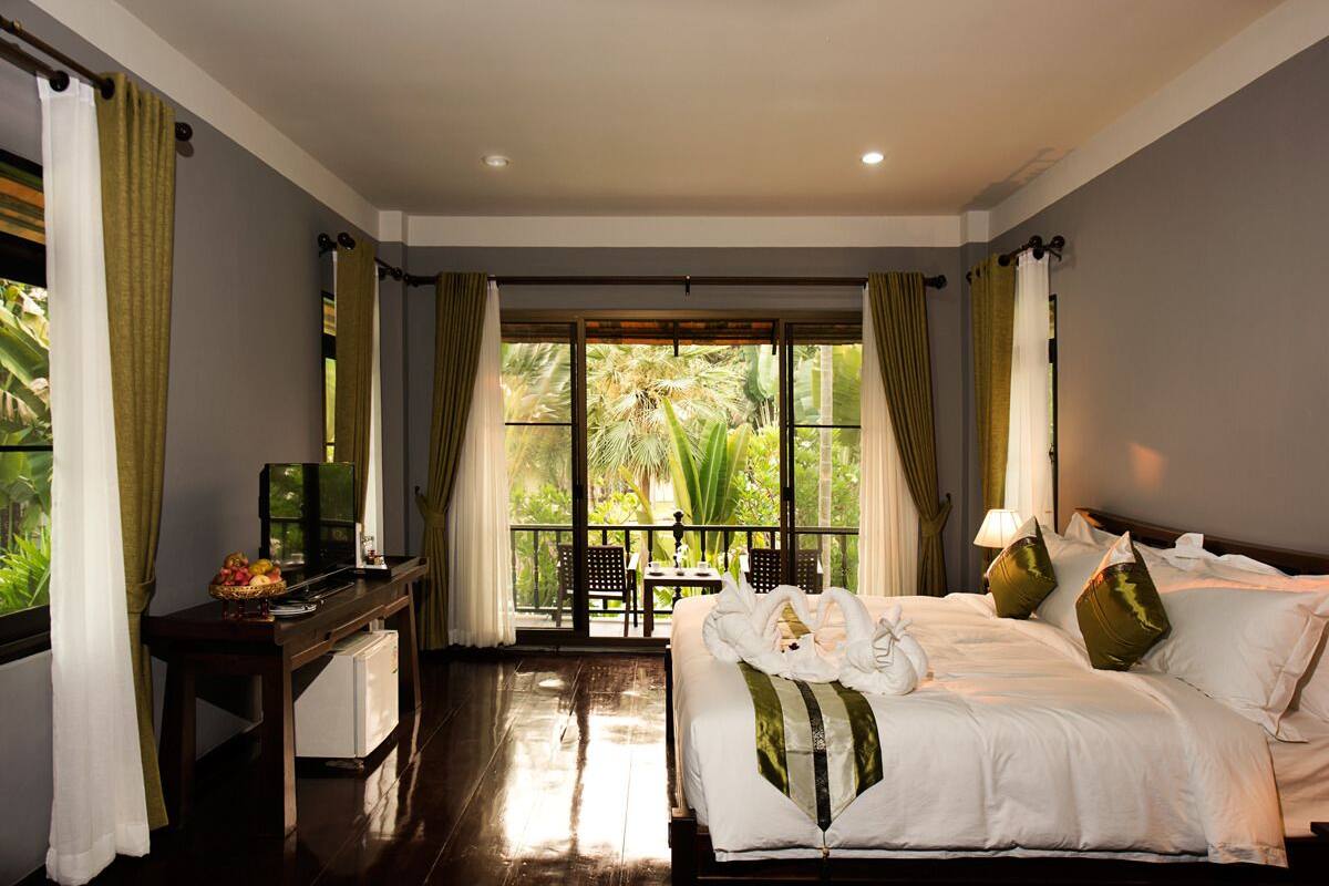 Lanna Garden View Room | Premium bedding, free minibar items, individually decorated