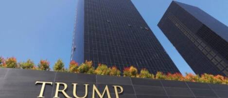 The Trump Towers building with a clear sky in the background.