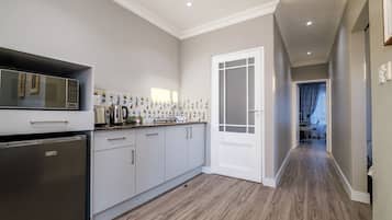 Luxury Suite | Private kitchen | Mini-fridge, microwave, espresso maker, electric kettle