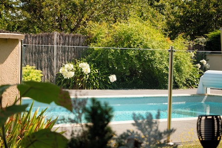 Seasonal outdoor pool, open 4:00 PM to 8:00 PM, pool umbrellas