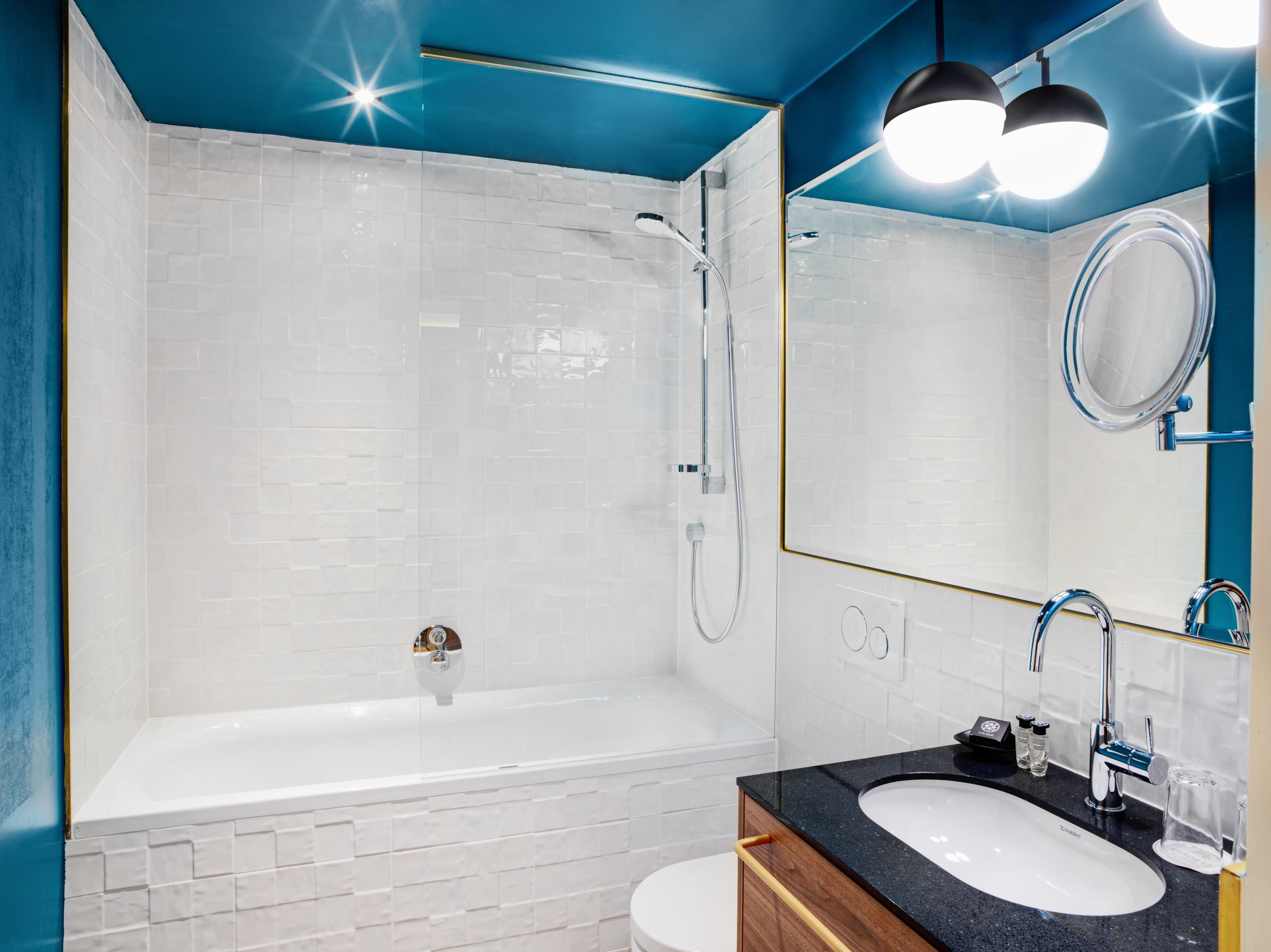 quadruple room | bathroom | deep-soaking bathtub, rainfall showerhead, free toiletries, hair dryer