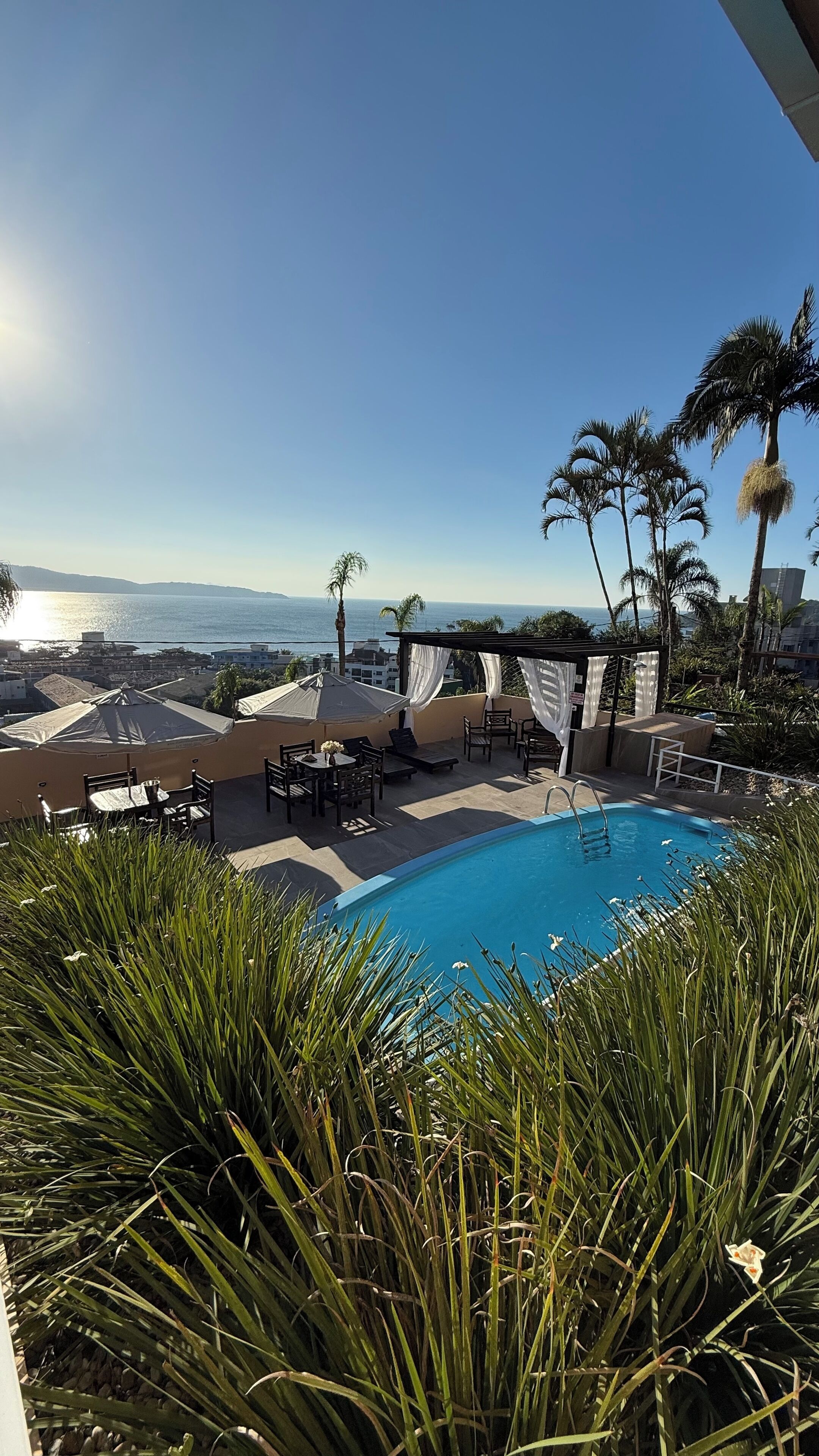 Seasonal outdoor pool, pool umbrellas, pool loungers