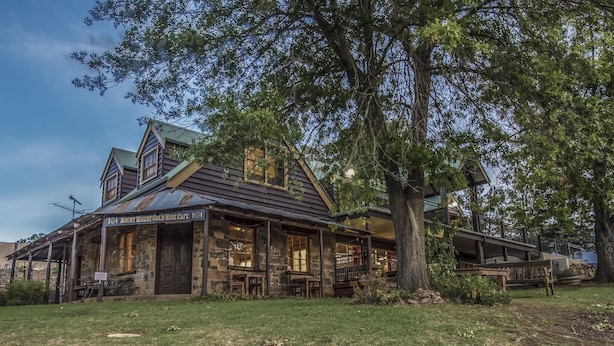 A rustic building with a sign reading "Mount Misery Gold Mine Cafe". - Gold Mine Guesthouse (Nundle)