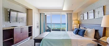 Desk, iron/ironing board, bed sheets