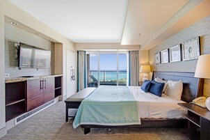 Desk, iron/ironing board, bed sheets