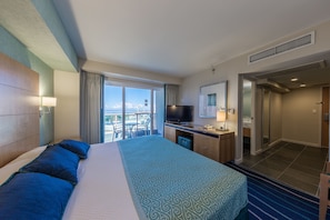Desk, iron/ironing board, bed sheets