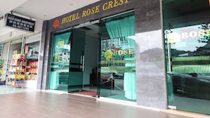 The exterior of Hotel Rose Crest Hill with a clear entrance, a signboard above the entrance, and a visible car parked outside. - Hotel Rose Crest Hill, Cameron Highlands (Tanah Rata)