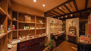A traditional Japanese room with wooden shelves, a wooden dresser, and a mirror.