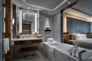 Separate tub and shower, designer toiletries, hair dryer, bathrobes