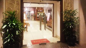 The entrance to JoJoBa Spa with a red welcome mat and potted plants. - Eastern Suites at Times Square KL (Kuala Lumpur)