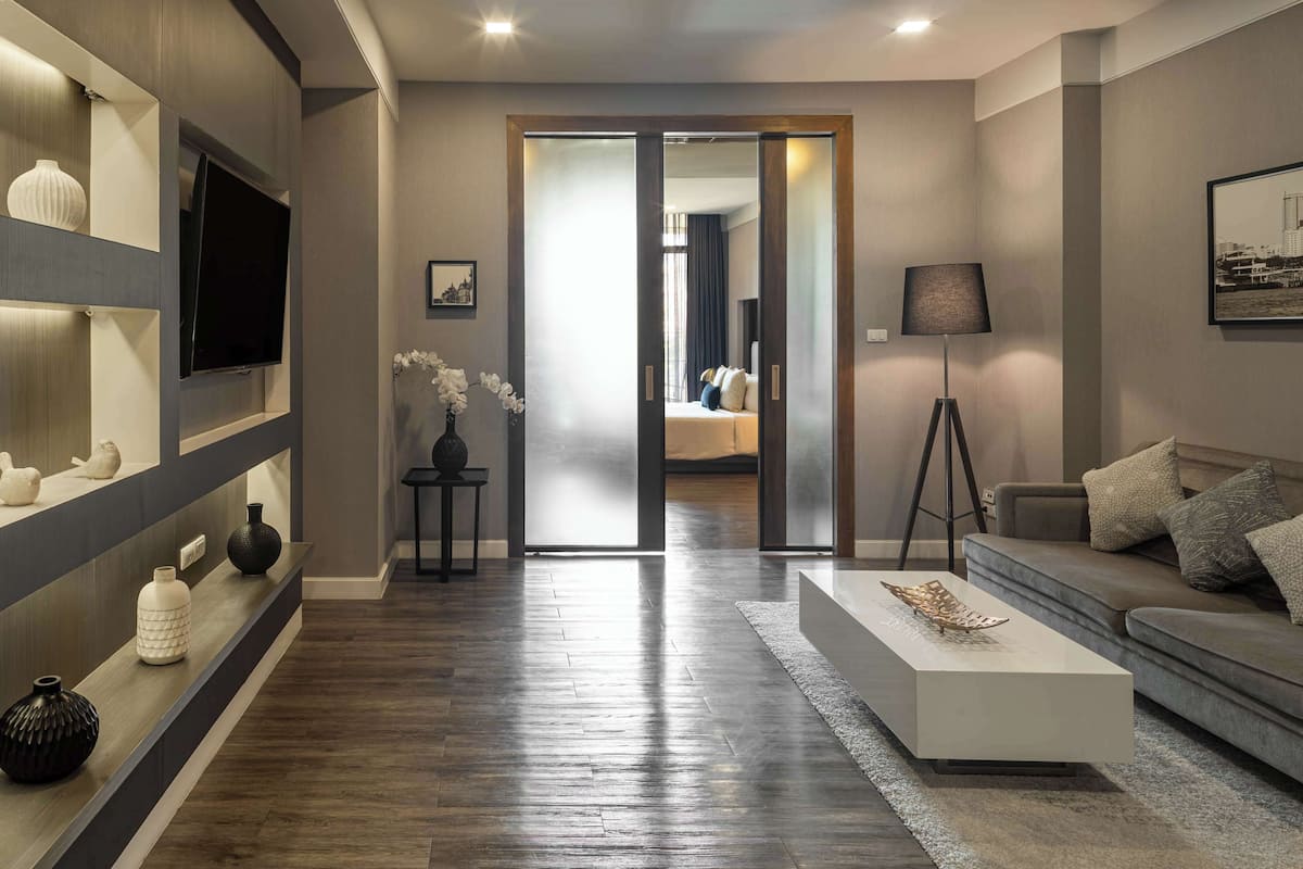 Deluxe Suite, 1 King Bed | Living area | 40-inch flat-screen TV with cable channels, TV