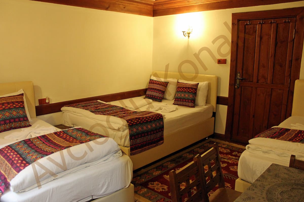 Family Room | Premium bedding, desk, laptop workspace, free WiFi
